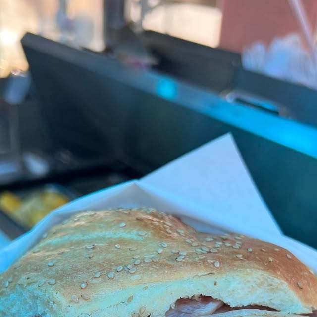 Close-up of a cemita de milanesa at Cemitas El Rey